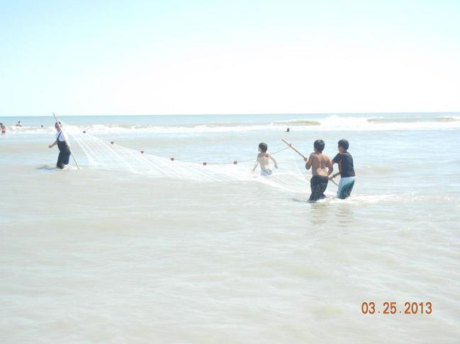 boys working a seine net