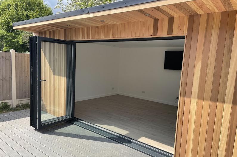 Large modern garden room with pool table and bar