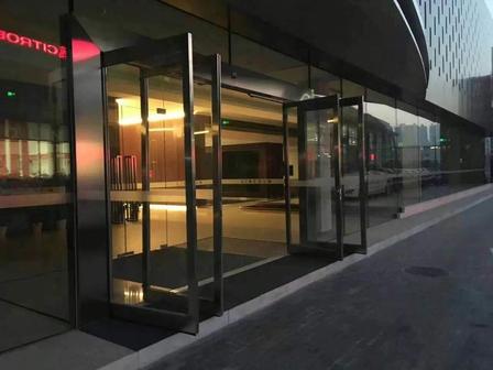 Swing out automatic sliding door