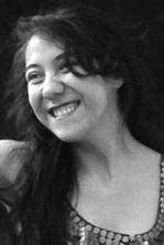 Picture of Dora, smiling and looking to the left of the camera