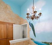 Master bath with painting of peacock