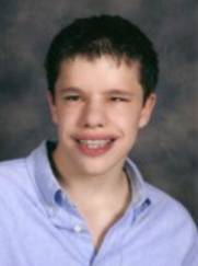 Head-shot of Westlee, smiling, looking at camera