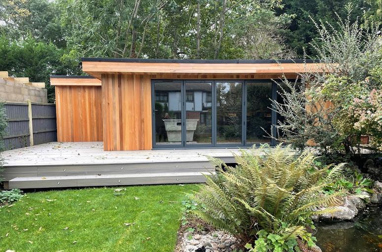 Large modern garden room with pool table and bar