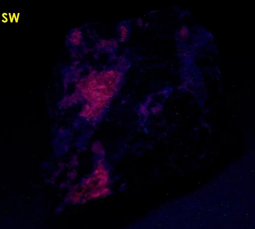 MAGNESIO-HORNBLENDE and fluorescent ALBITE, Philips Mine (Philips Pyrite Mine; Anthony's Nose Pyrrhotite Mine), Anthony's Nose, Philipstown Township, Putnam County, New York, USA