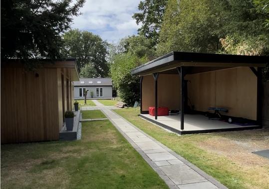 Large modern garden room with pool table and bar