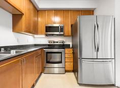 Kitchen with rang and 3 door refrigerator