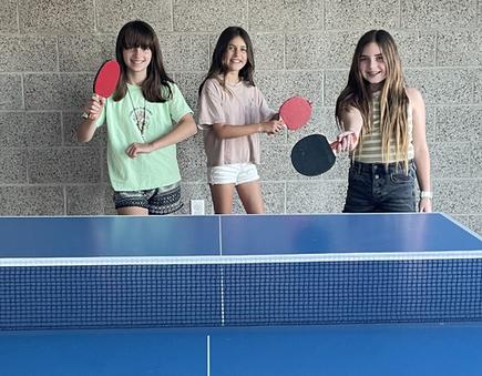 (l-r) Clementine Nation, Olivia Mucha, and Jade Pellman show off our new ping pong table.