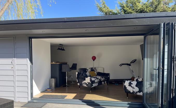Large modern garden room with pool table and bar