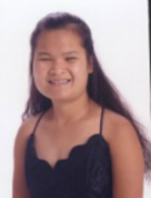 Portrait shot of Tieu, smiling, looking at camera.