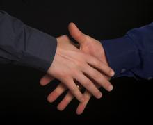 Shaking hands as a greeting