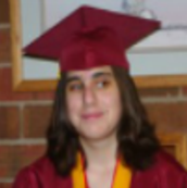 Graduation picture of Justine, wearing cap & gown.