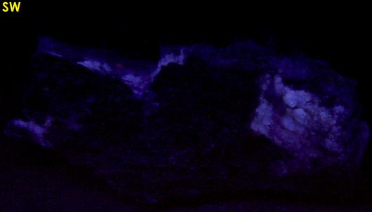 fluorescing FLUORITE, CALCITE, PYRITE with MUSCOVITE - Thomaston Dam railroad cut, Thomaston, Litchfield County, Connecticut, USA