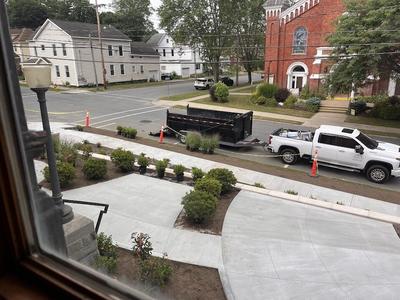 Placed plants from inside window, truck in street