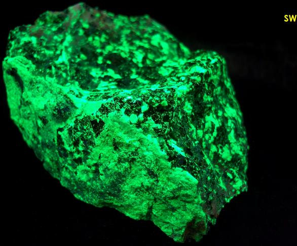 phosphorescent fluorescent WILLEMITE, HYDROZINCITE, CALCITE, ZINCITE, FRANKLINITE - Sterling Mine, Sterling Hill, Ogdensburg, Franklin Mining District, Sussex County, New Jersey, USA - Zincite and Franklinite type locality