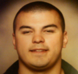 Head shot of Marcus, smiling at camera.