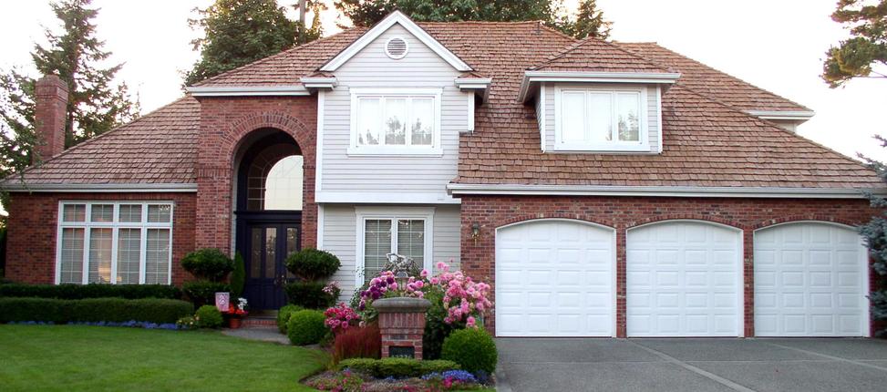 This Garage Area Is Really Beautiful I Love The Choice Of Stone On The Walls And The Different Sized Garage Door Garage Doors Residential Garage Doors Garage