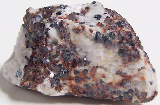 Black Franklinite, red Zincite, white Hydrozincite, green fluorescent Willemite, white Calcite - Sterling Mine, Sterling Hill, Ogdensburg, Franklin Mining District, Sussex County, New Jersey, USA