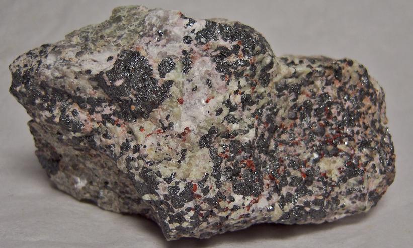 FRANKLINITE, ZINCITE, fluorescing WILLEMITE, CALCITE and HARDYSTONITE - Franklin Mine, Franklin, Franklin Mining District, Sussex County, New Jersey, USA - type locality of Franklinite, Zincite, and Hardystonite - sold