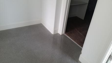 polished concrete carpet transition in to closet