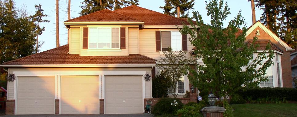 Professional garage door contractors install new garage doors.