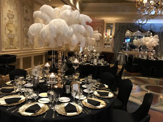 Black candelabra ostrich feathers centerpiece - RentalCenterpiece