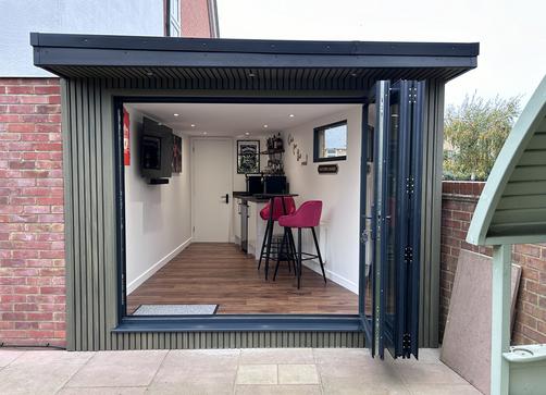 Large modern garden room with pool table and bar
