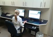 image of a woman working at a desk