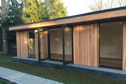 Large modern garden room with 2 full length windows either side of open French doors
