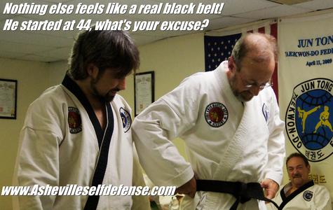 Dan putting on his first black belt, at age 47. Middle age is not a problem for us!