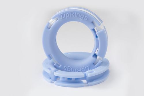 Closeup of Zip Rings, patented design As shown, comes preloaded with dental floss