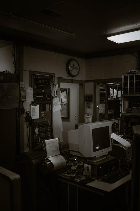 gloomy black and white office space at night