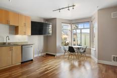 Living Room and Kitchen area. Large window nook.