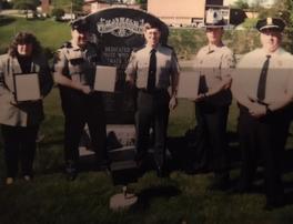 Laird Cole receiving letter of recognition from the Pennsylvania State Police