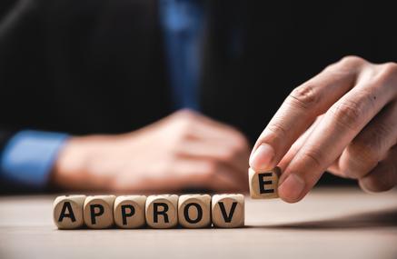 Wooden blosk with approved letters