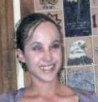 Head-shot of Melissa, smiling, looking at camera.