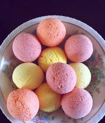 An image of a 'Bath Bomb Citrus Collection,' showcasing a variety of bath bombs in vibrant citrus-themed colors
