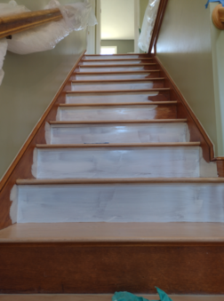 Staircase priming risers and skirtboards in Mansfield, MA.