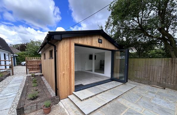 Large modern garden room with pool table and bar