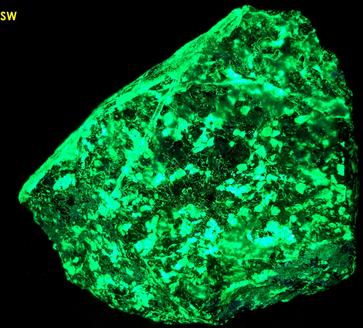 phosphorescent fluorescent WILLEMITE, HYDROZINCITE, CALCITE, ZINCITE, FRANKLINITE - Sterling Mine, Sterling Hill, Ogdensburg, Franklin Mining District, Sussex County, New Jersey, USA - Zincite and Franklinite type locality