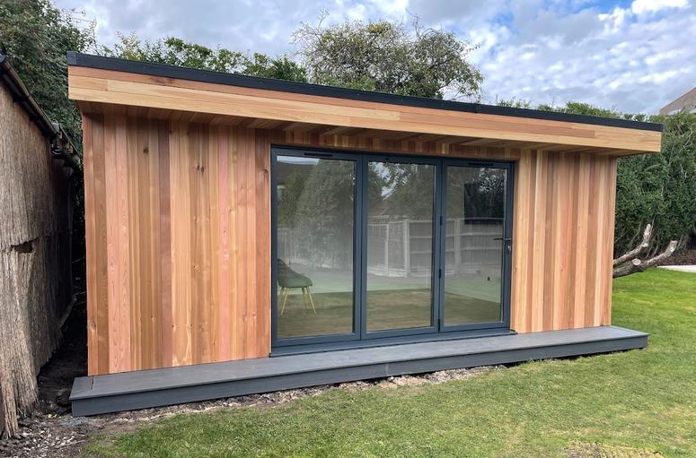 Large modern garden room with pool table and bar