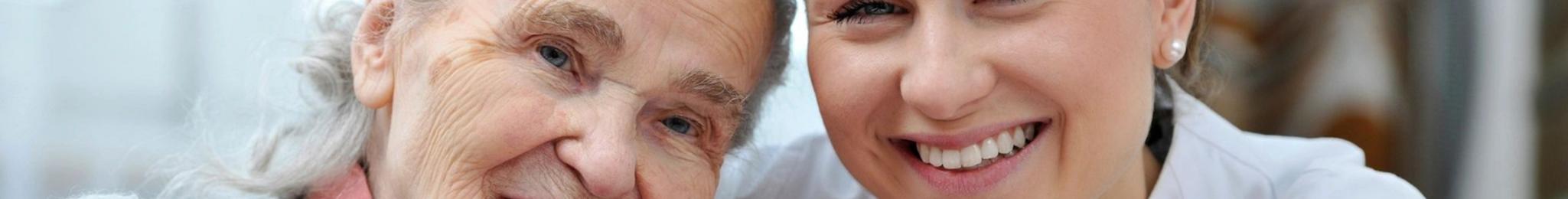 Featherstone Assisted Living Nurse smiling with resident
