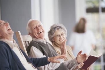 Elderly group laughing and smiling