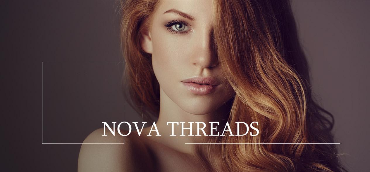 Red head woman looking into camera. Learn about Nova Threads!