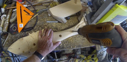 How to make a beach decor fish shaped towel rack. Drilling holes for the wood dowels. www.DIYeasycrafts.com