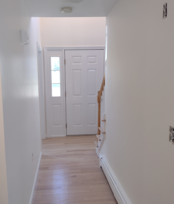 Foyer walls and trim painted in Raynham, MA.