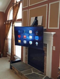 4K Ultra HD Curved TV Mounted over Fireplace using Dynamic Mounting's down and out mount. TV easliy pulls down in front of fireplace for a lower viewing height. Carolina Custom Mounts, Charlotte NC