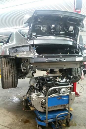 Porsche 911 being taken apart to be fixed in Syracuse, NY
