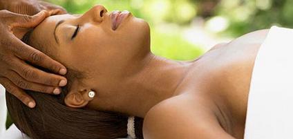 a woman is taking head massage