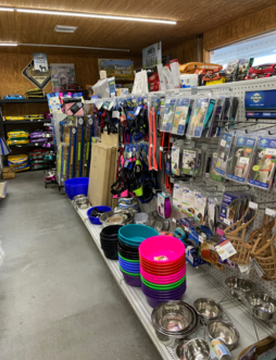 Dog cages, feeder pans, muzzles and more, Remington Feed Dog Supply aisle.