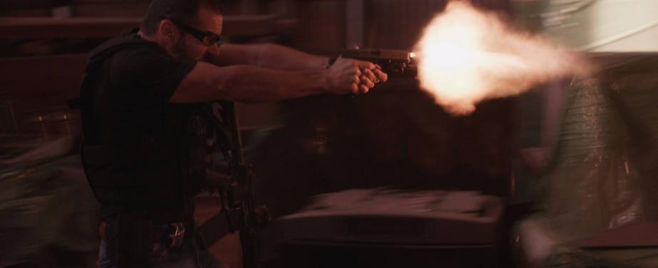 undercover police officer firing Glock